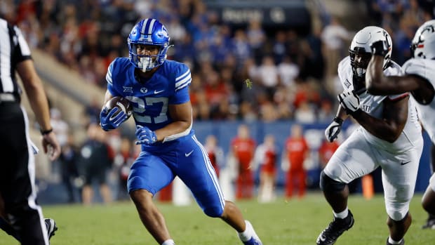 Sep 29, 2023; Provo, Utah, USA; Brigham Young Cougars running back LJ Martin (27) runs the ball in the second half against the Cincinnati Bearcats at LaVell Edwards Stadium. Mandatory Credit: Jeff Swinger-USA TODAY Sports